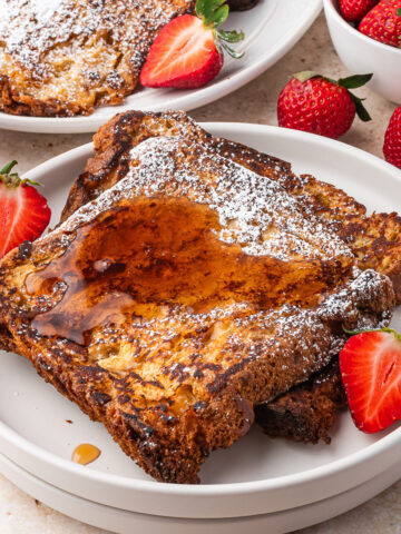 A slice of Panettone French Toast with syrup.
