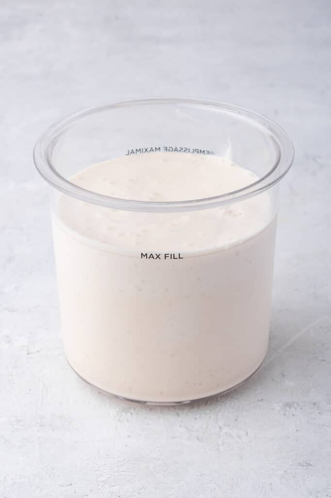 The Ninja Creami Vanilla Cottage Cheese Ice Cream mixture in the pint container before freezing