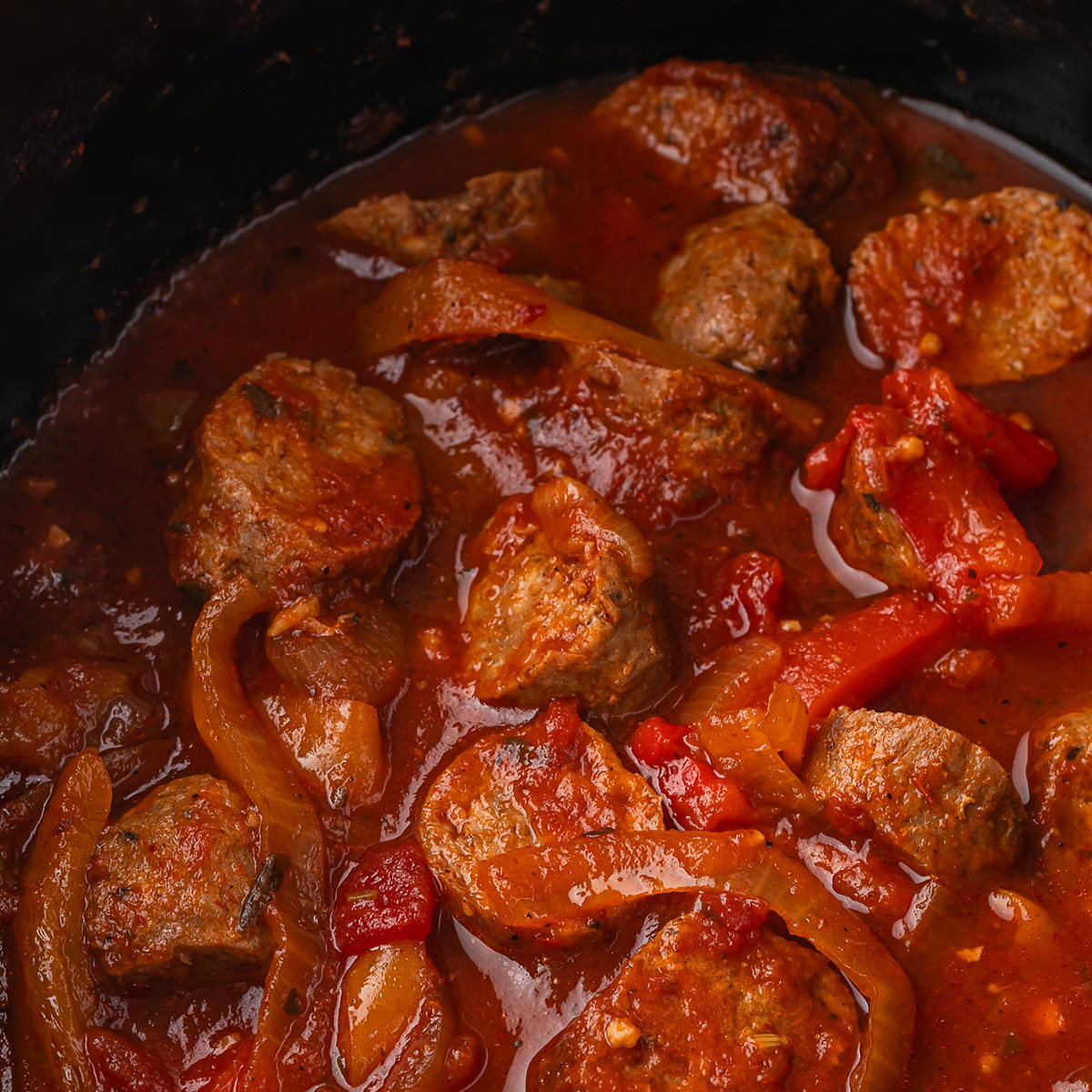 A close up of Slow Cooker Sausage and Peppers in the slow cooker