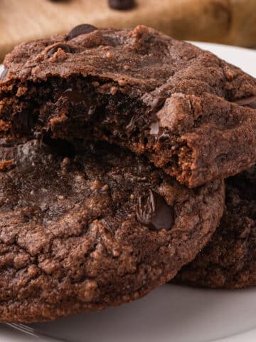 A close up of Easy Brownie Mix Cookies with a bite out of one of them.