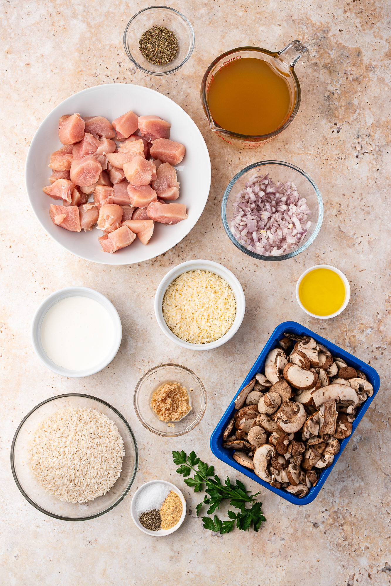 A mis-en-place of ingredients for Creamy Mushroom Chicken and Rice