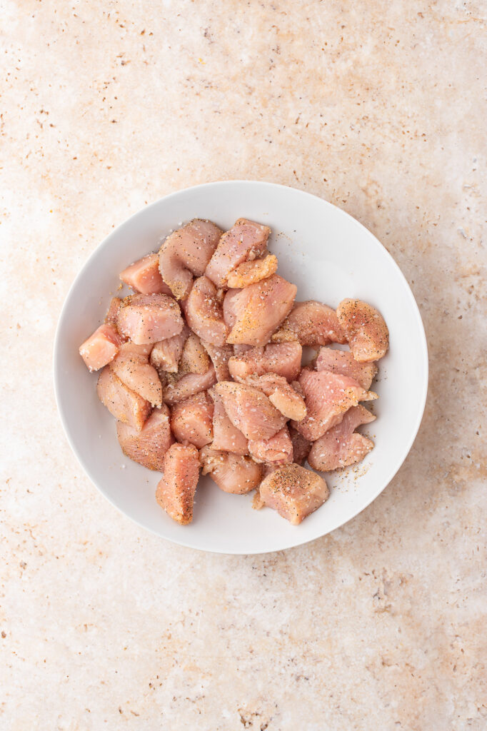 A bowl of raw chicken