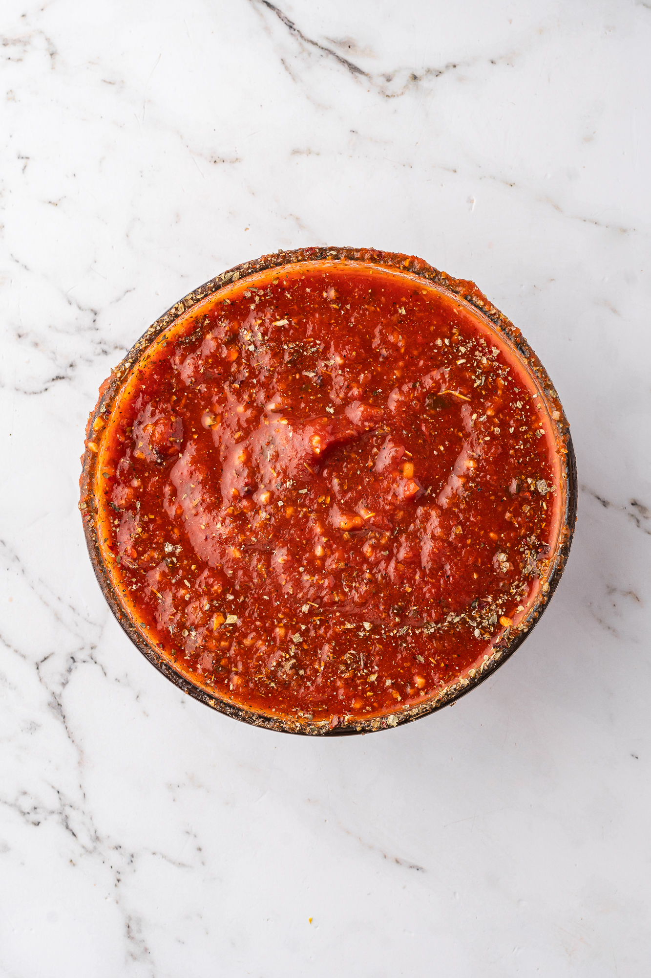 The tomato sauce mixture in a glass bowl