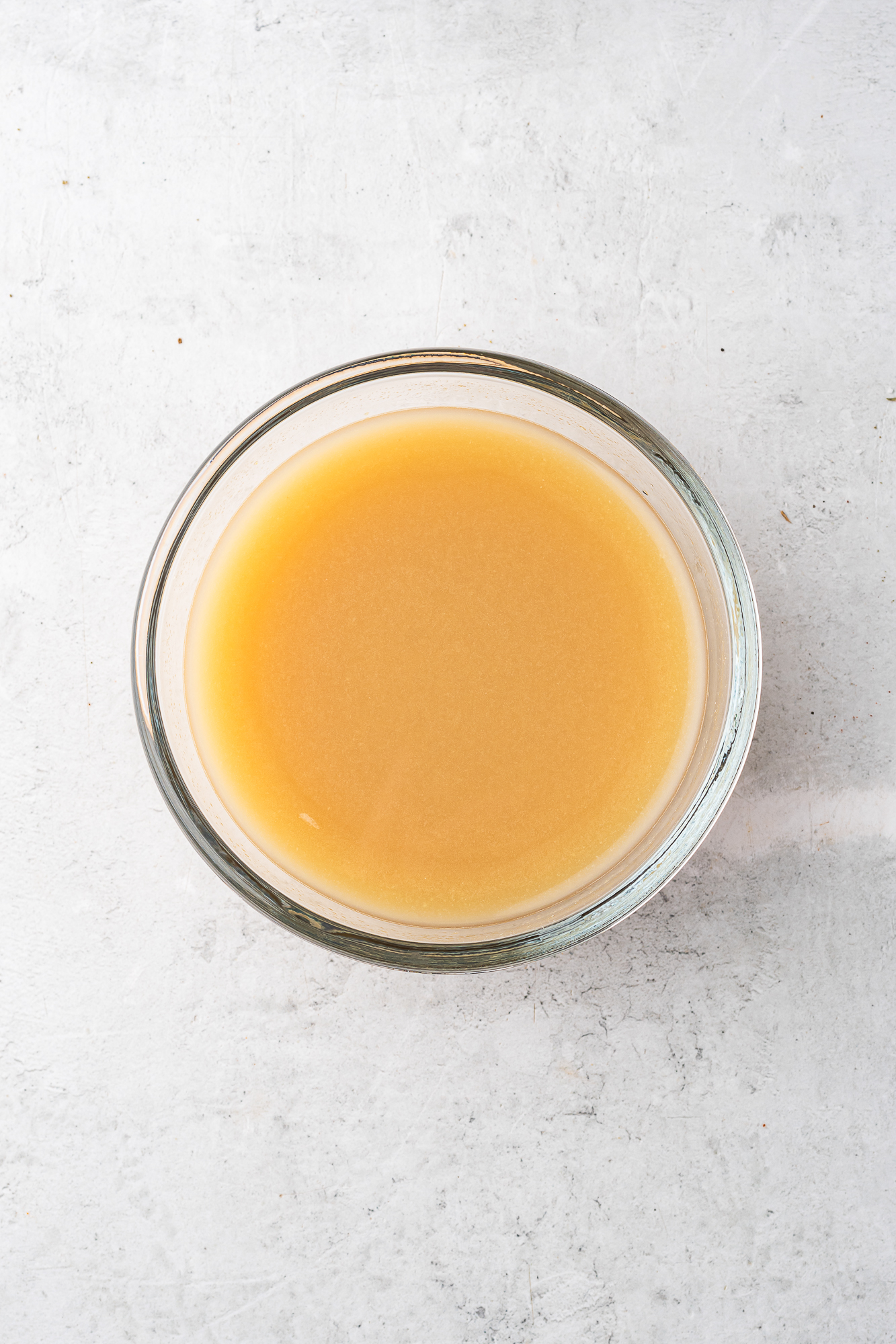 A small glass bowl of the prepared broth