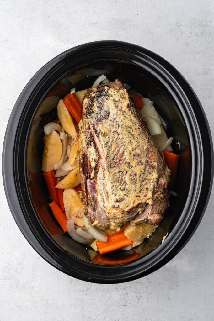 A slow cooker of Slow Cooker Pork Roast before cooking