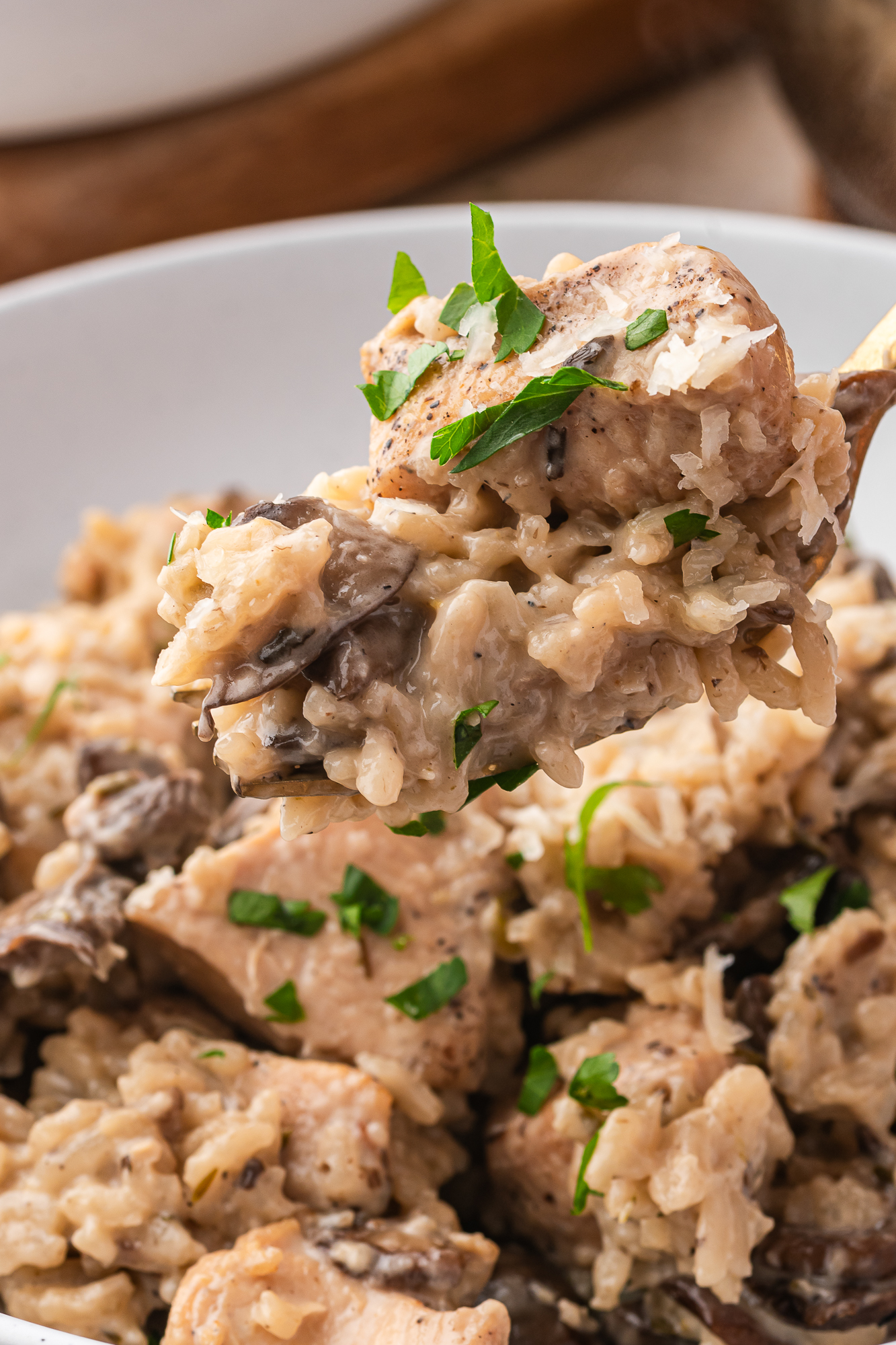 A close up of a forkful of Creamy Mushroom Chicken and Rice