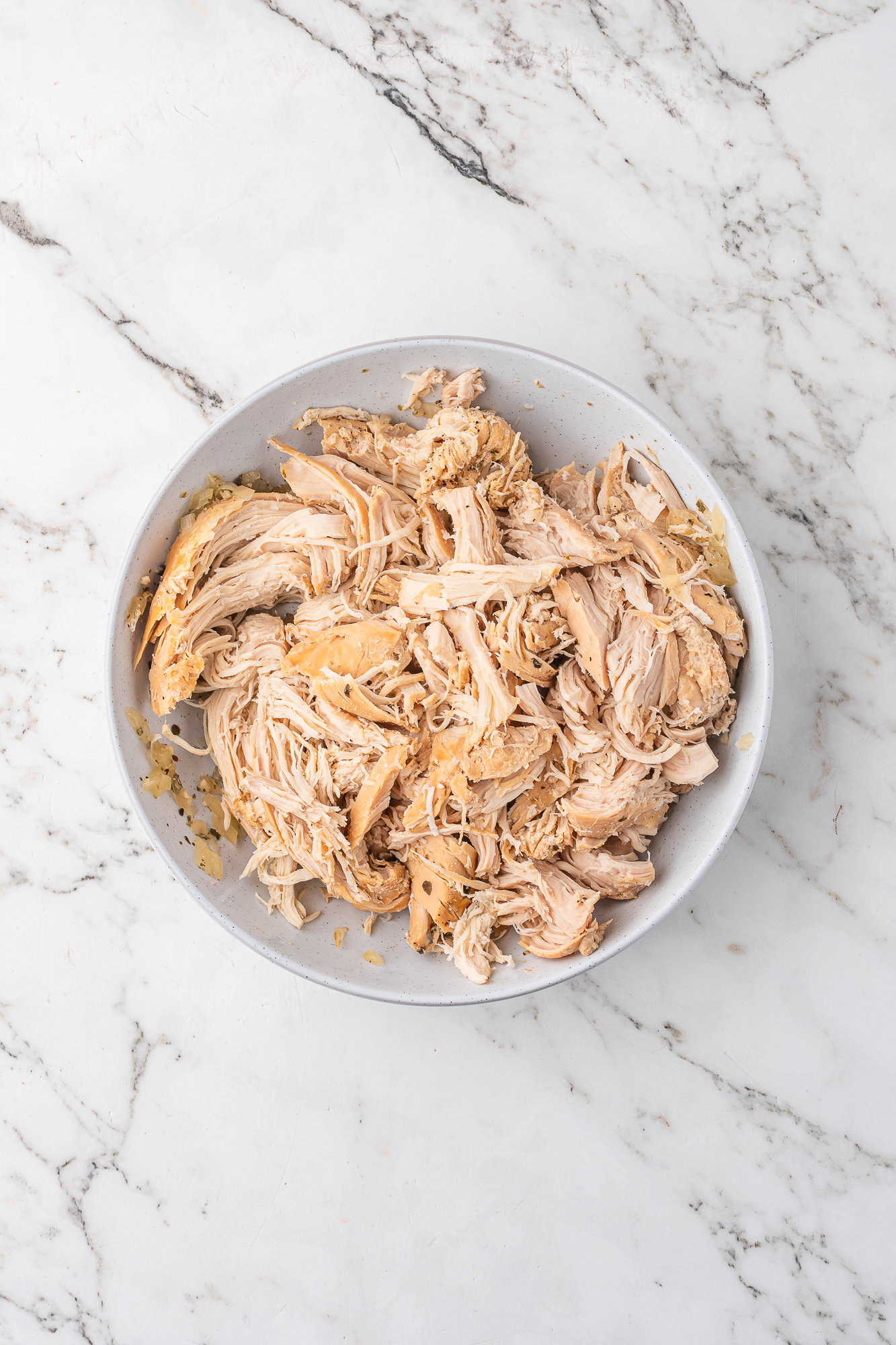A bowl of shredded chicken