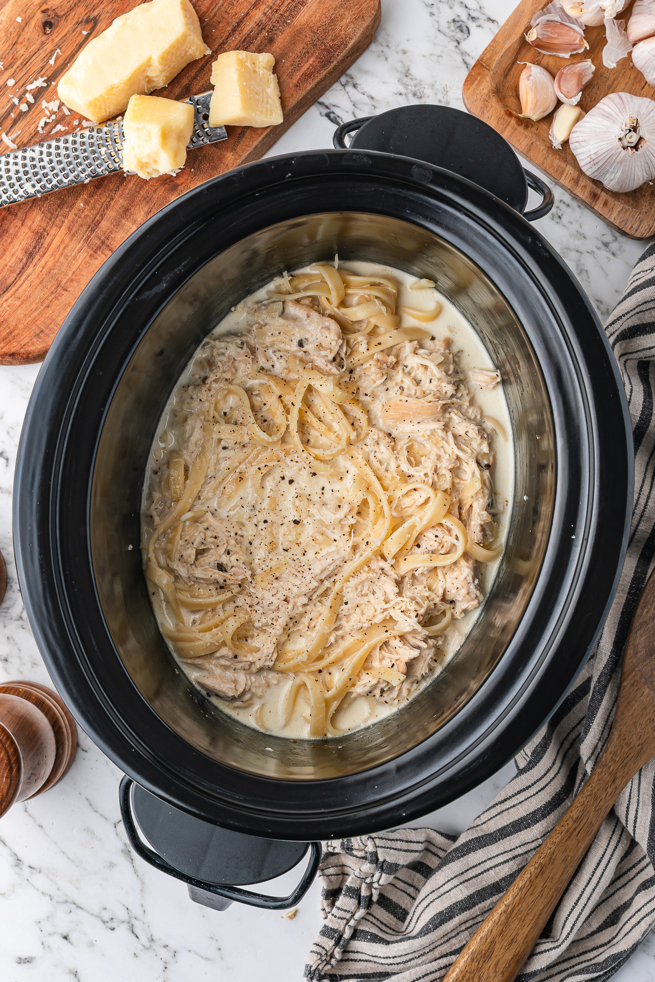 A slow cooker base of Slow Cooker Chicken Alfredo